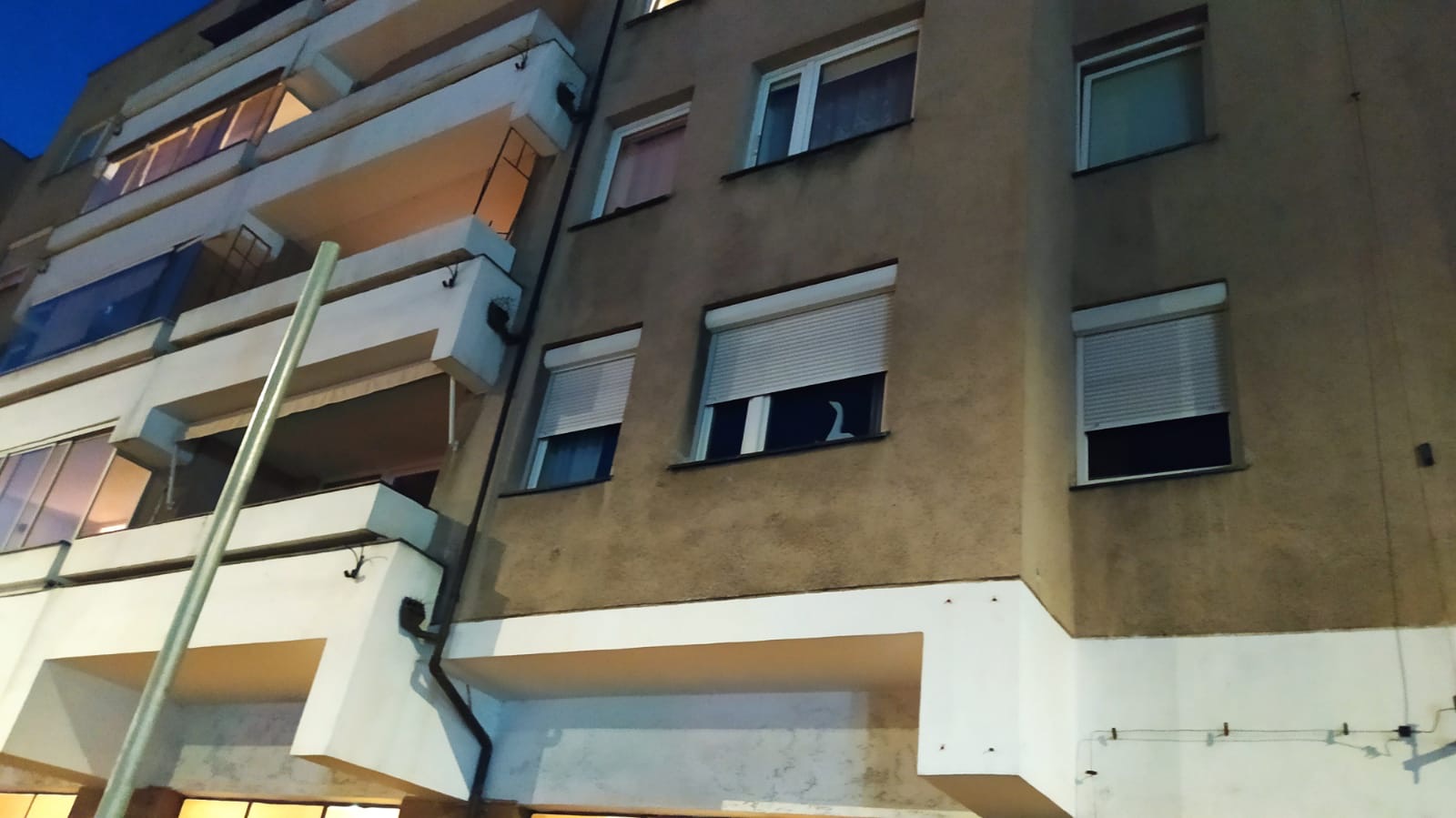 Exterior roller shutters on a residential facade, view 002