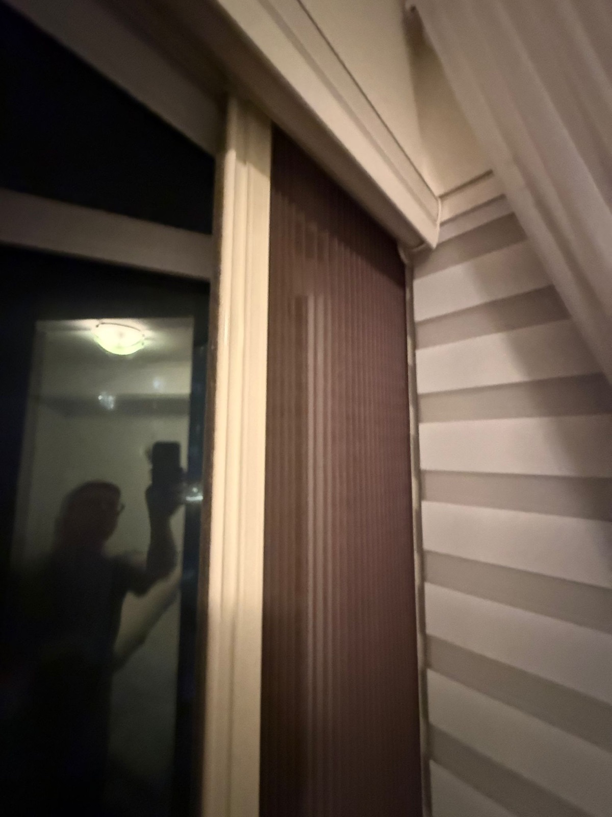 Pleated retractable insect screen installed on a patio door, view 002