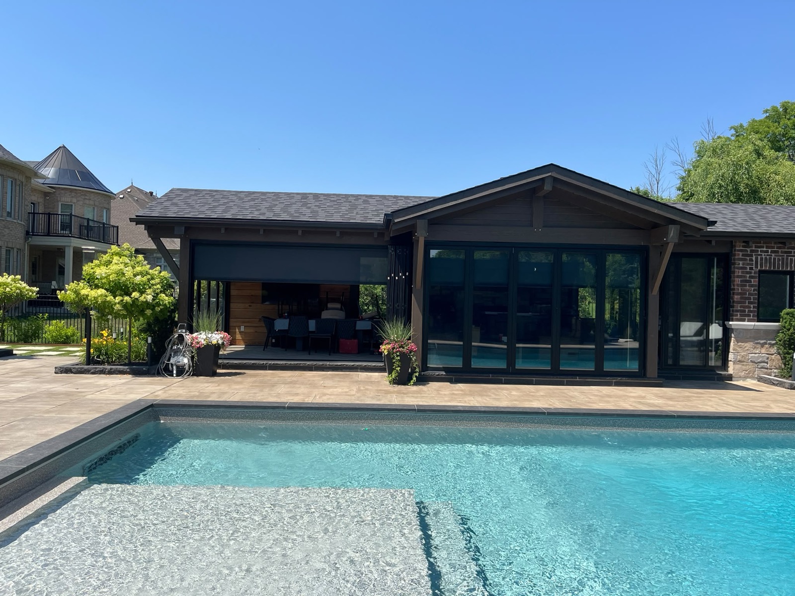 Outdoor screen system installed on a pool cabana, view 010