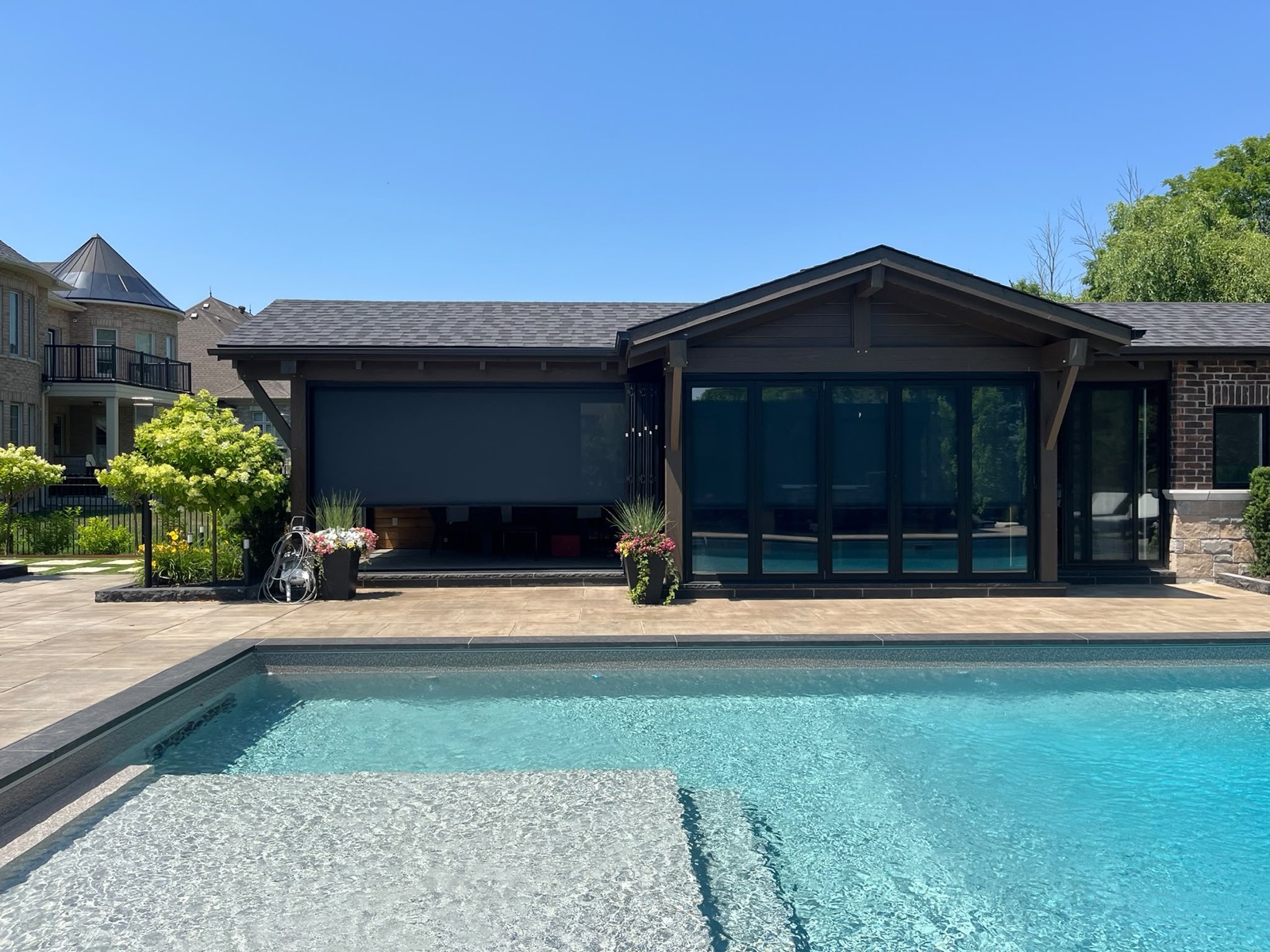 Outdoor screen system installed on a pool cabana, view 015