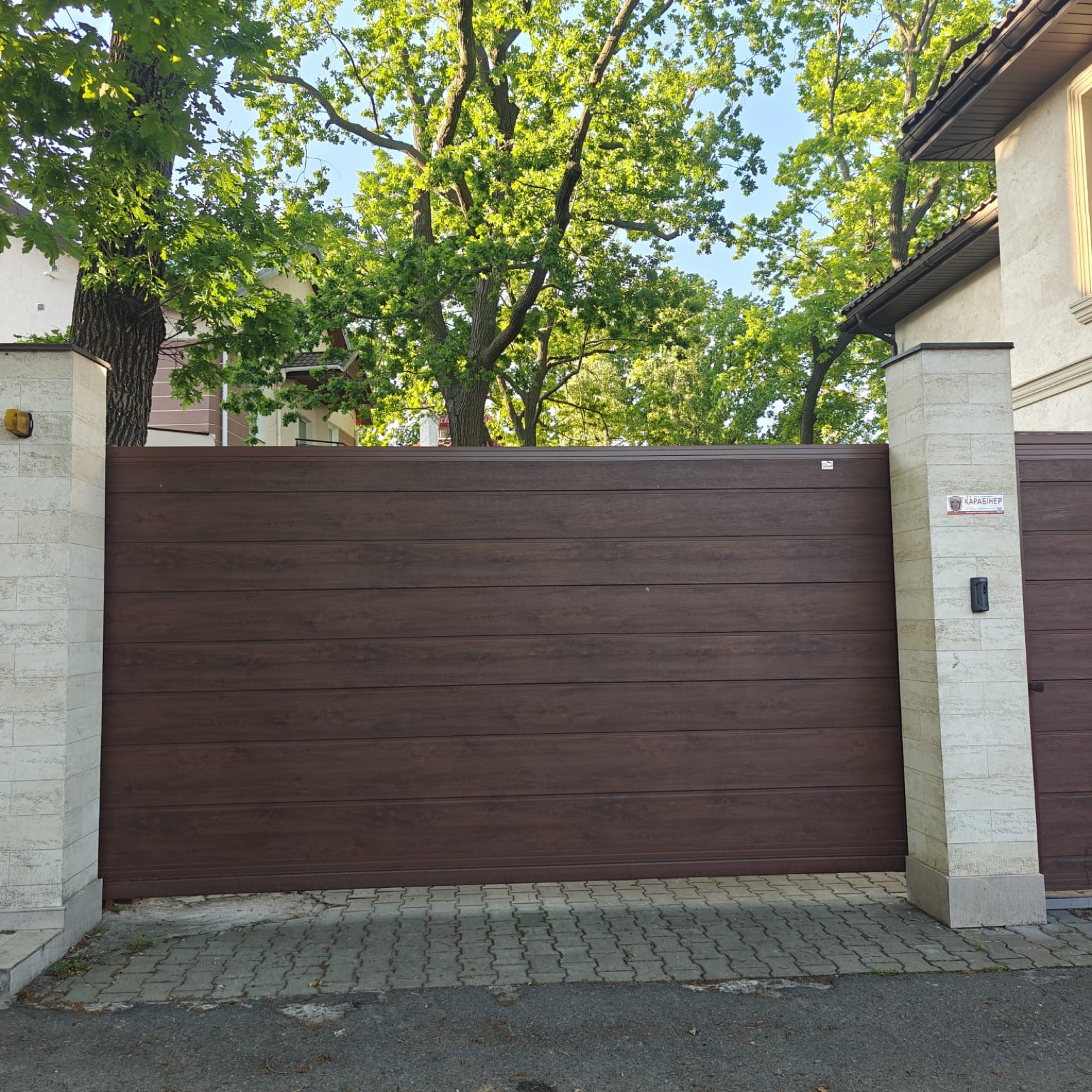 Rolling garage door on a residential property, view 005