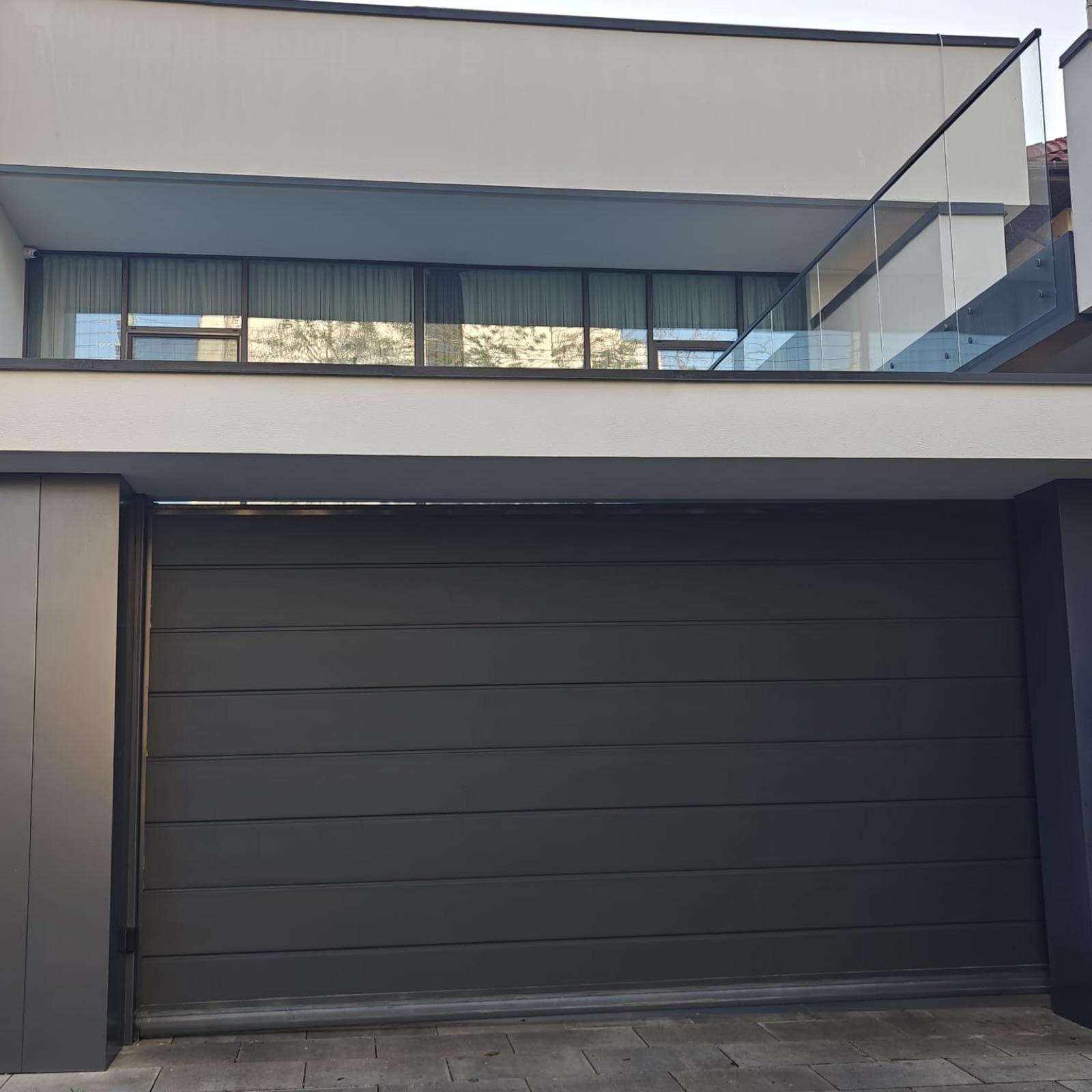 Rolling garage door on a residential property, view 009